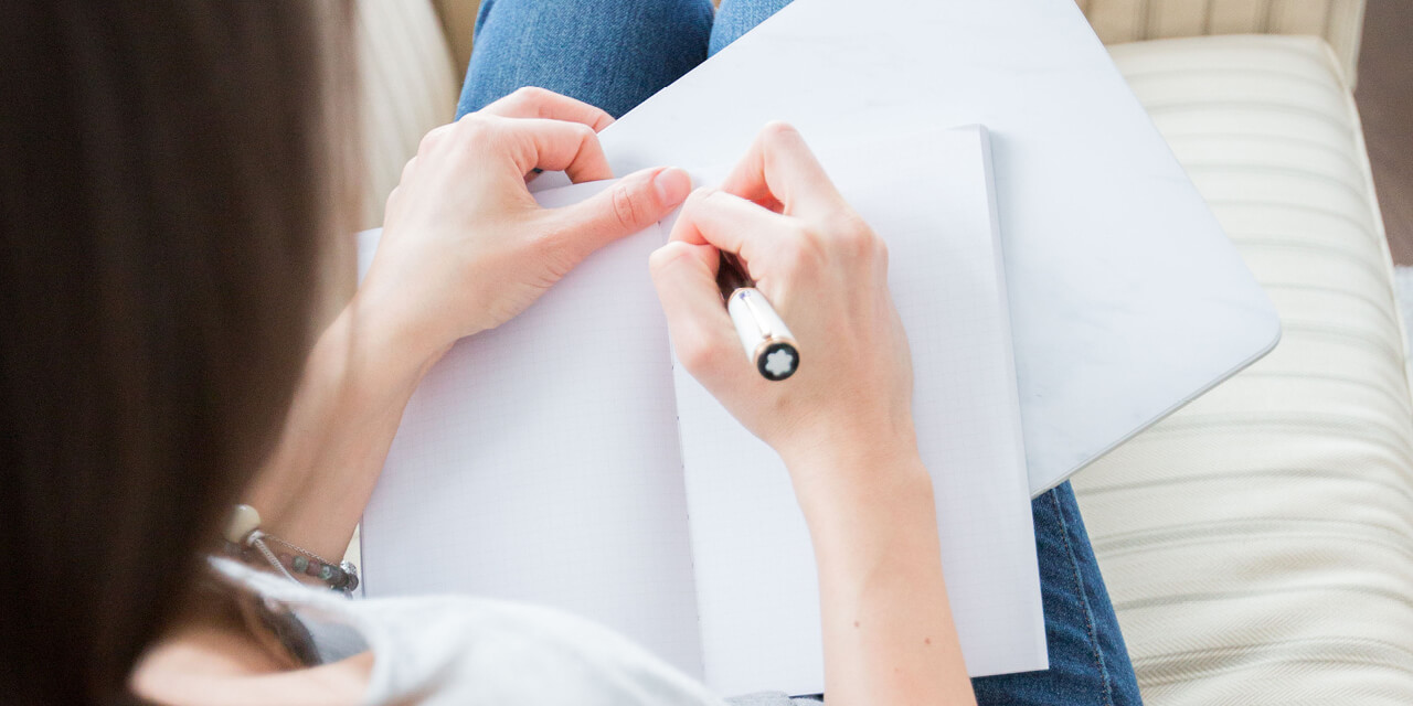 girl writes in her notebook