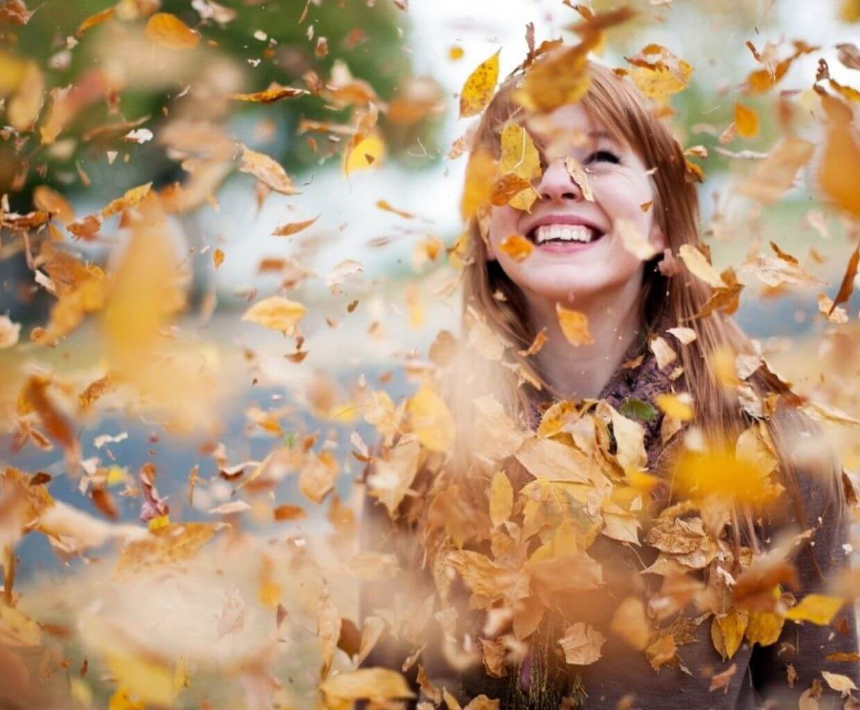 pic of girl playing with leaves